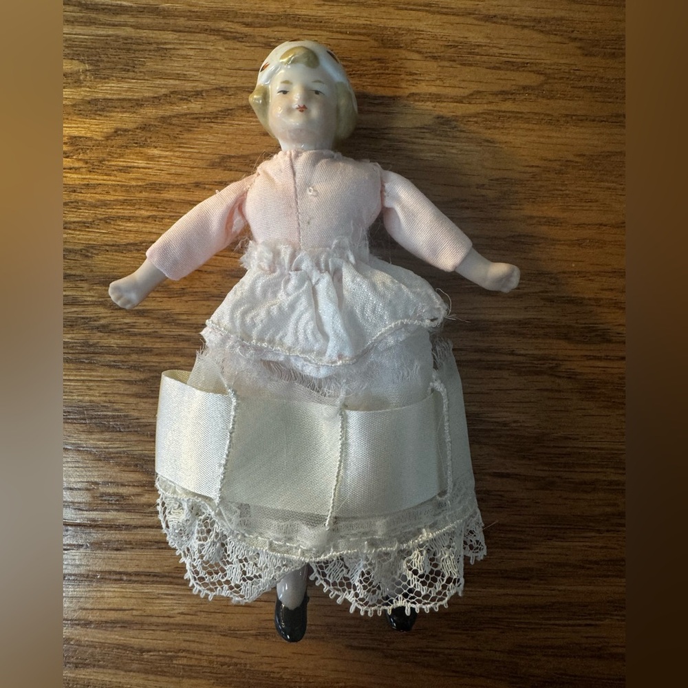 Vintage Porcelain Doll with Pink and White Dress